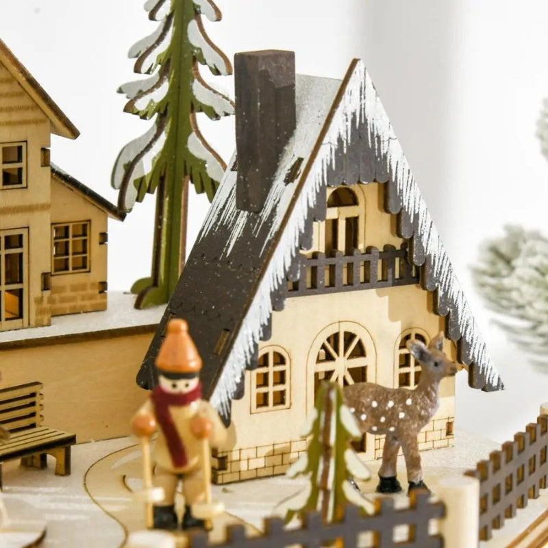 Calendrier de l’Avent en bois représentant un village avec lumières LED