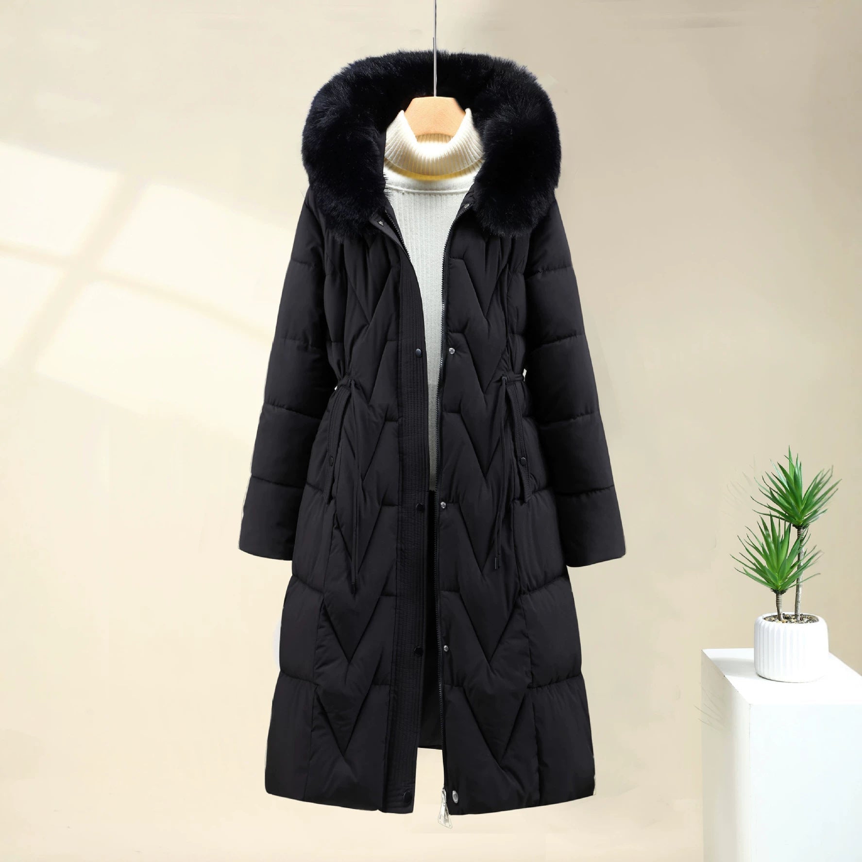 Doudoune longue à capuche pour femme avec bordure en fausse fourrure