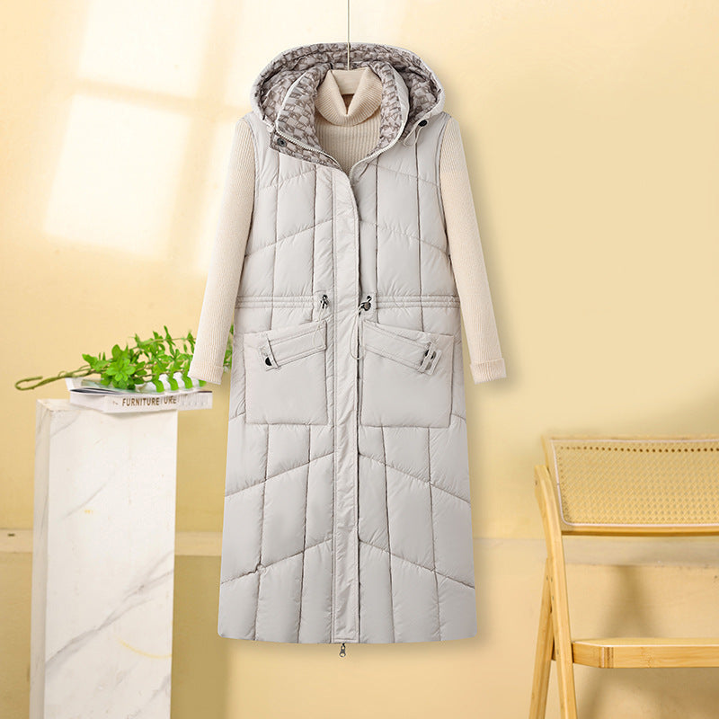Gilet matelassé long à capuche pour femme, avec taille à cordon de serrage